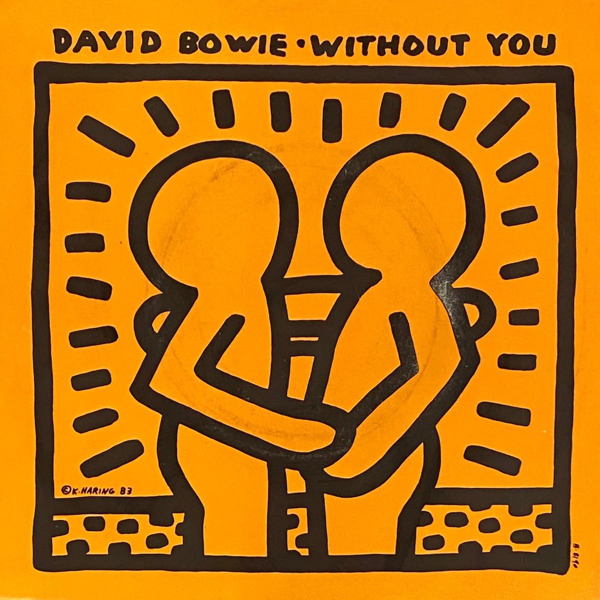An album cover featuring Keith Haring's artwork